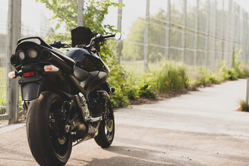 Black motorcycle close-up on the street.