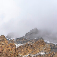Square crop Misty clouds over the rugged and rocky slope of Provo Canyon mountain in Utah