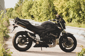 Fototapeta na wymiar Black motorcycle close-up on the street.