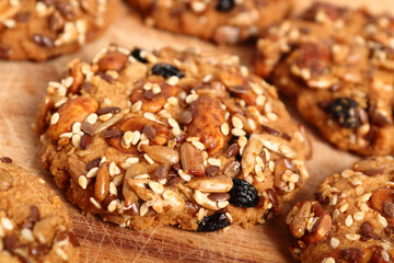 Multi seed cookies on wooden board. Macro.
