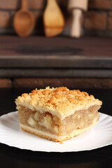 Apple Pie on disposable paper plate. Double crust apple pie with cinnamon made with shortcrust pastry.