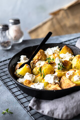 Baked potato with mozarella cheese 