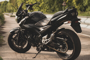 Black motorcycle close-up on the street.