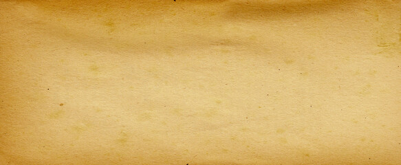 Old brown paper parchment background design with distressed vintage stains and ink spatter and white faded shabby center, elegant antique beige color