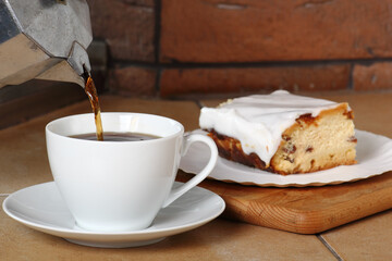 Pouring Coffee into Cup and Cheesecake. Breakfast.