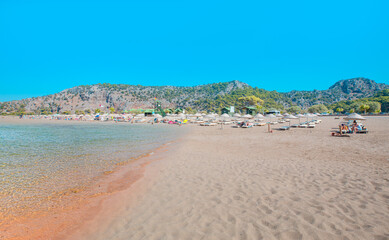 Holidaymakers sunbathing at  Iztuzu beach -  Dalyan, Turkey