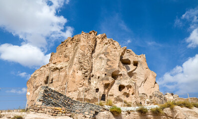 The ancient fortress Uchisar Castle were carved in natural rock formations in Cappadocia. this is a highest point in the region.Turkey.
