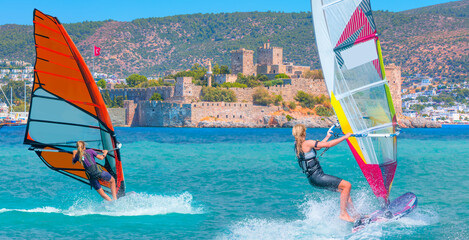 Beautiful cloudy sky with Windsurfer Surfing The Wind On Bodrum, Turkey