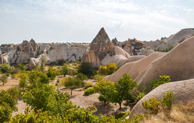 Unique fancy geological mountain formations with dovecotes of the Pigeon valley in Goreme, Cappadocia, Turkey