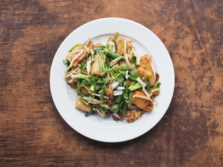 Top view stir fried radish cake with spring onion and bean sprout