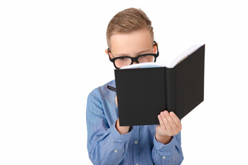 Attractive caucasian schoolboy wearing eyeglasses holding a notebook pen in hands isolated on a white background, a boy wearing glasses, a child is getting ready to go to school