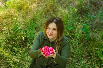 young girl with flowers in the garden