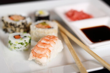 Sushi set with gari and soy sauce on plate