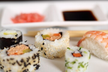 Sushi set with gari and soy sauce on plate