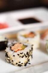 Sushi set with gari and soy sauce on plate