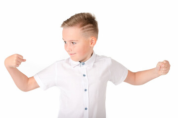 Close up image.The strong smiling school boy on a white background shows the force.