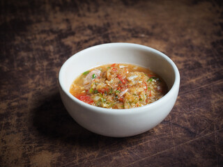 Thai spicy and sour dipping sauce as seafood garnish
