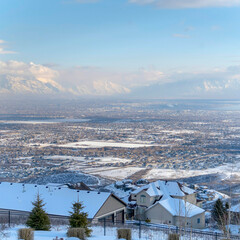 Square Homes on a mountain terrain with panoramic view of the valley and cloudy sky