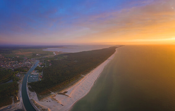 Poland, Pomerania, Leba, Aerial view of coastline at Slowinski National Park at sunset