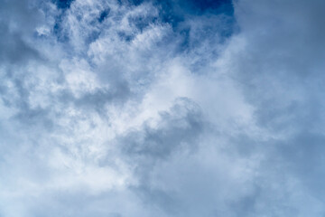 Bright cumulus clouds on a blue sky