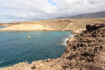 Coastline with cliffs and Atlantic Ocean near beach Playa de los Morteros on Canary Island Tenerife, Spain