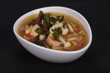 Thai style soup with meat and mushrooms
