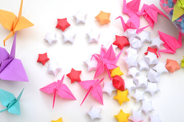 Origami cranea and luck stars background