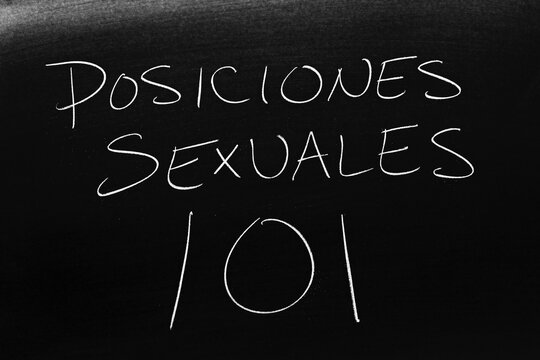 The words Posiciones Sexuales 101 on a blackboard in chalk.  Translation: Sex Positions 101 