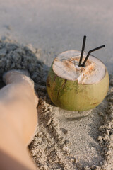 Relax on paradise bounty beach with coconut and white sand. Vertical photo, film effect