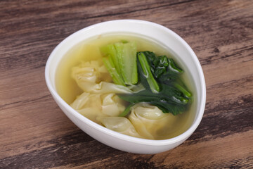 Asian traditional Wonton soup with herbs