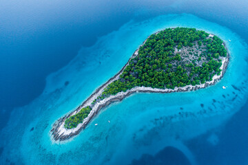 Aerial shot of an island in form of a drop located in Croatia