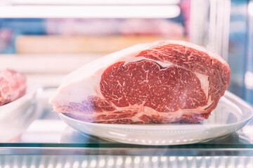 Premium Rare Sirloin Dry-Aged  Wagyu A5 beef with high-marbled texture inside refrigerator.
