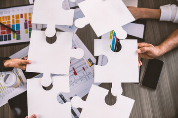 Teamwork of partners. Concept of integration and startup with puzzle pieces
