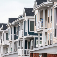 Square frame Row of new built American houses day light