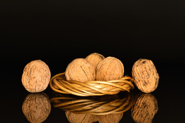 Ripe tasty, organic walnut, close-up, on a black background.