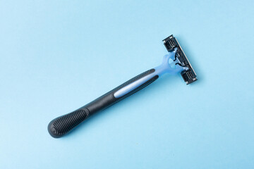 Razor blade on a blue background