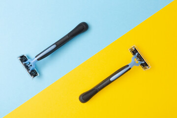 2 blue disposable razor blades.