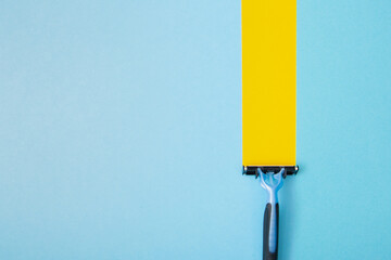 Razor blade sliding across a blue background