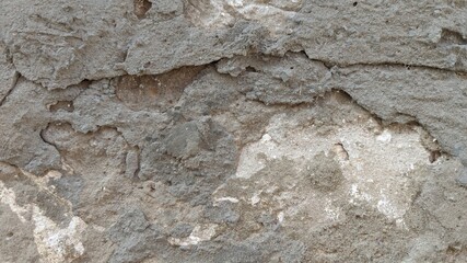 Close up uneven plaster surface texture background. horizontal rough abstract surface texture.