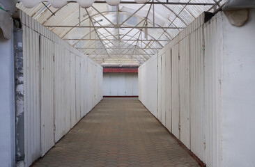 closed pavilions with clothes,rows of closed pavilions at the fair, closed small business, inflation