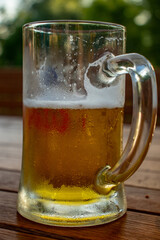 glass of beer on wooden table