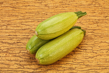 Young tasty zucchini over board