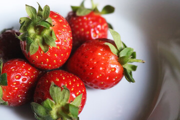 strawberries on the plate white background