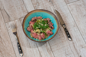 Tasty and healthy salad with roast beef