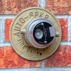 Square Automatic Fire Sprinkler on a brick wall