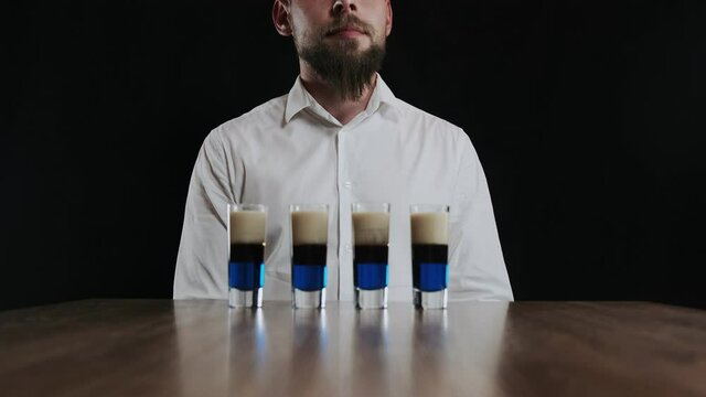 Set of several shot glasses with lexus cocktails. Ready for drinking
