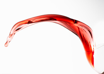 Obraz na płótnie Canvas Rose wine splashing on white