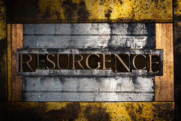 Resurgence text formed with real authentic typeset letters on vintage textured silver grunge copper...