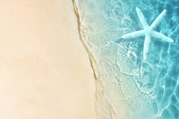 Fototapeta na wymiar Summer sand beach background. Starfish and sea. Summer concept.