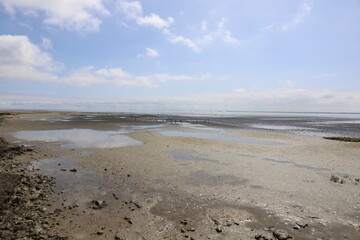 Beautiful panoramic view over the Sea at very low tide with a blue sky.  Photo was taken on a sunny May day with a beautiful blue lunch with white clouds.